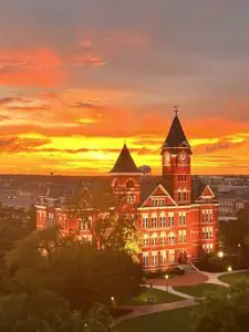 A sunset view of the building and tower.